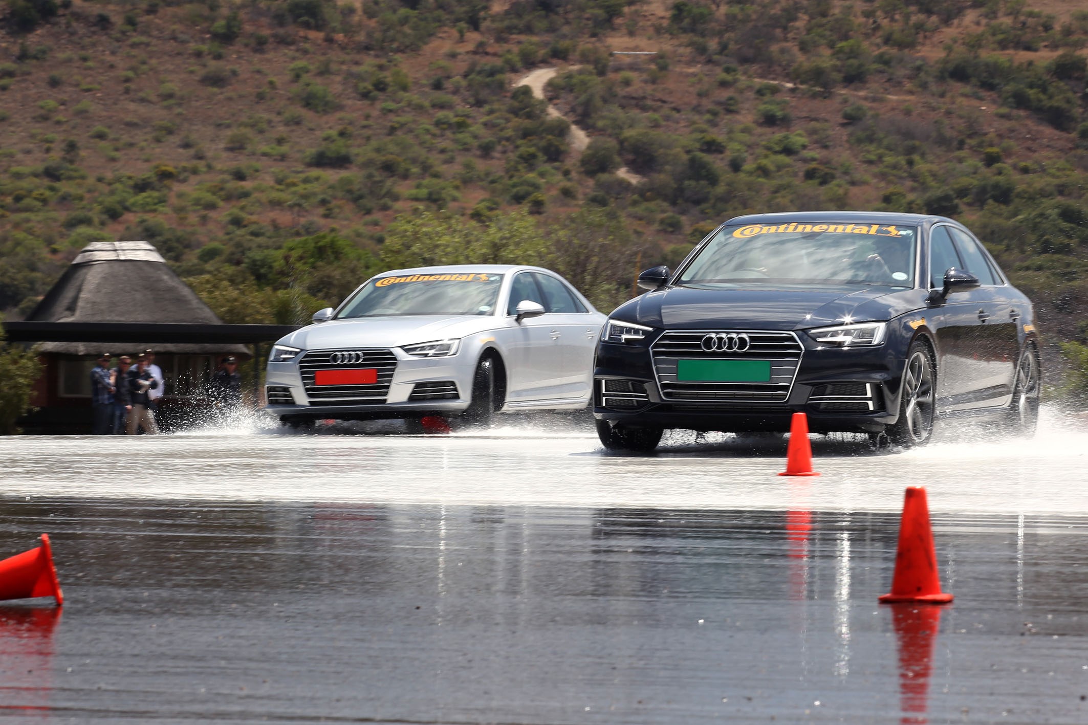 Photo by Inga Terblanche Two identical vehicles demonstrate handling on a wet skidpan at the Gerotek Test Facilities during the Automobile Association’s (AA) car tyre safety demonstration. The car on the right (green number plate) has brand new tyres, the car on the left (red number plate) has worn tyres. 