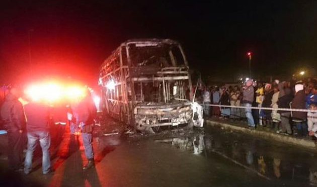 Bus hit by petrol bomb front