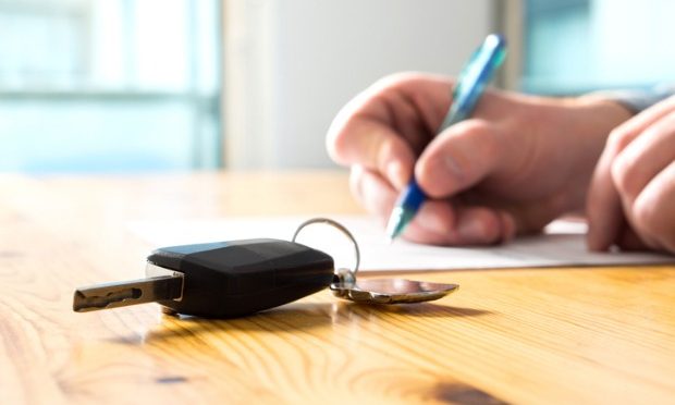 How to register a car in your name_istock