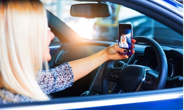 Selfie Day- DON'T selfie and drive_istock
