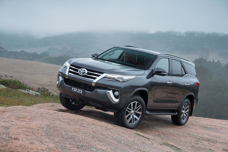 Toyota Fortuner parked on rock