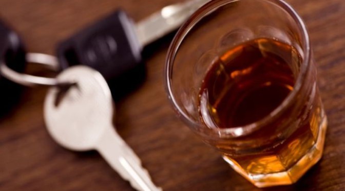 combat drunken driving - keys and glass of alcohol